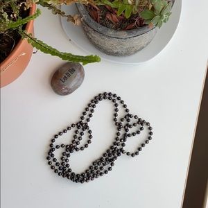 String of Brown Beads, Layer